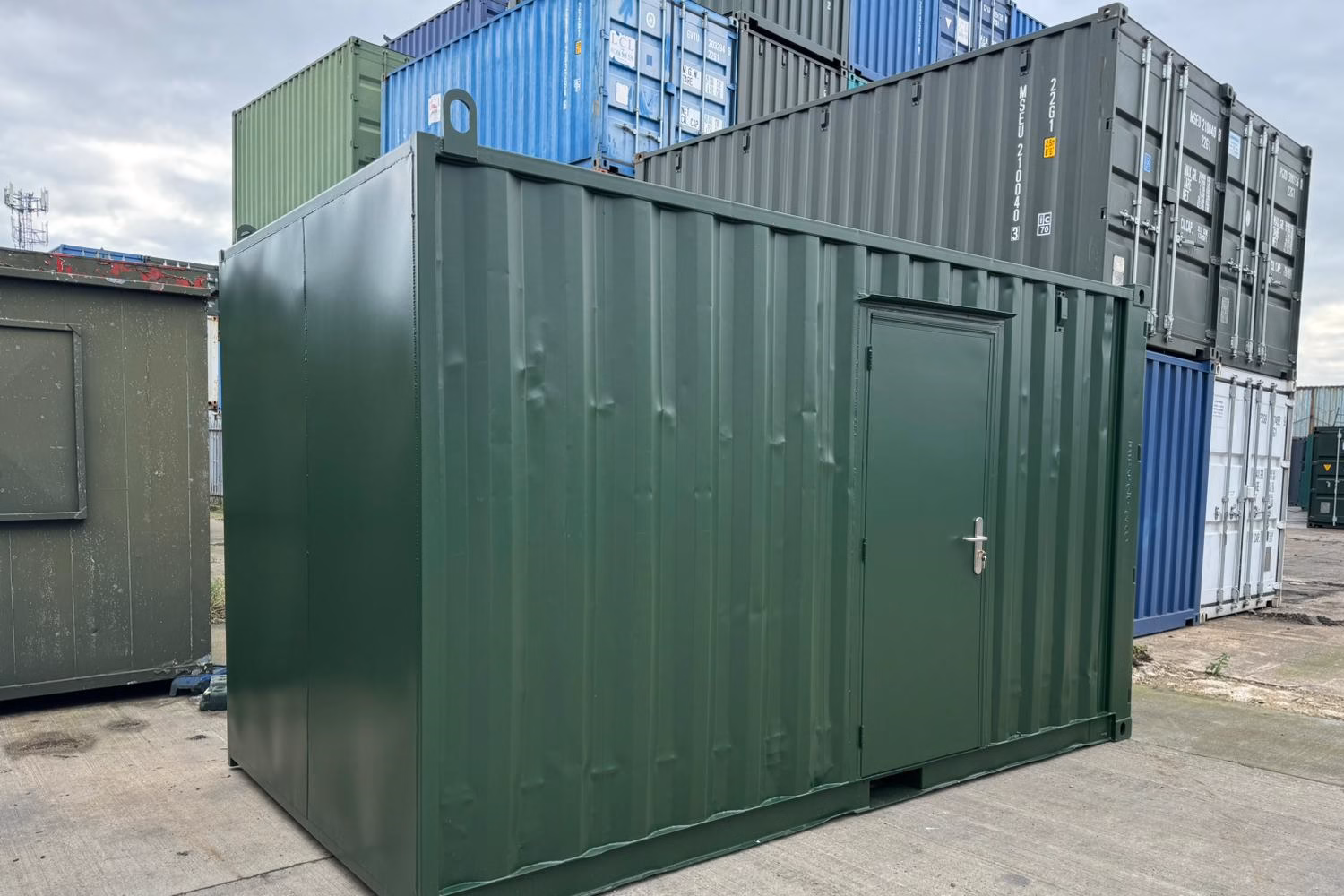 Green container converted into an office with door